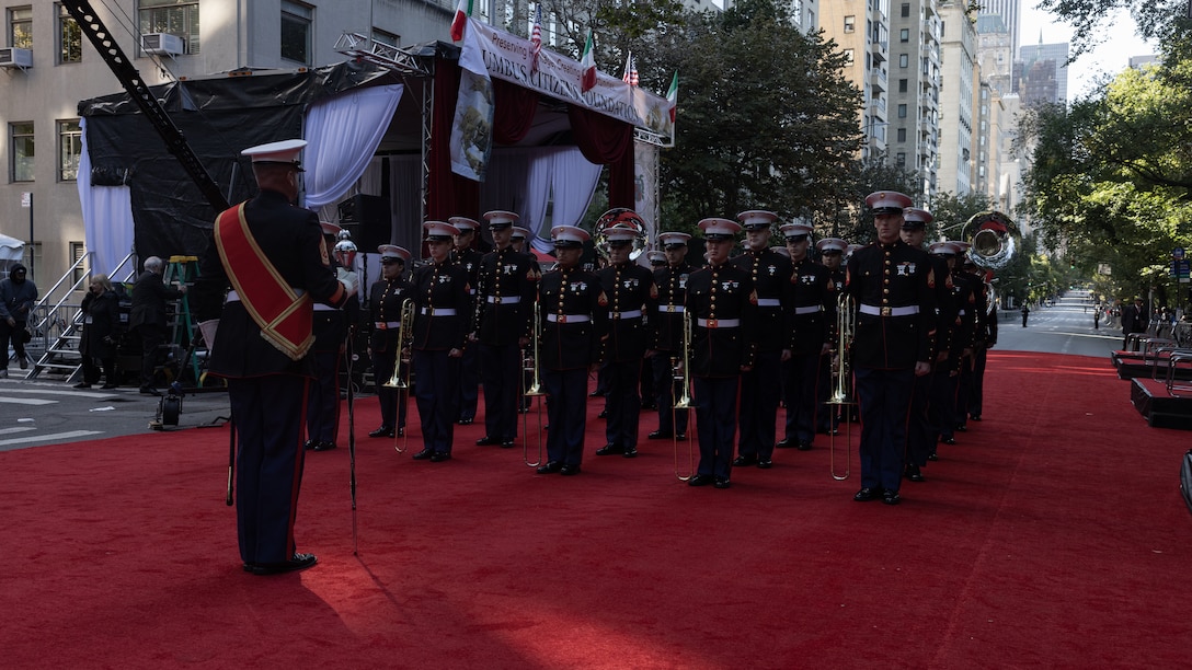 U.S. Marines with the 2nd Marine Aircraft Wing (MAW) Band stand in formation during the 79th Annual Columbus Day Parade at Manhattan, New York, Oct. 9, 2023. Marines with the 2nd MAW Band performed during the 79th Annual Columbus Day Parade to strengthen community relationships and reaffirm history, customs, and traditions representative of the United States Marine Corps to those in attendance. 2nd MAW is the aviation combat element of II Marine Expeditionary Force. (U.S. Marine Corps photo by Lance Cpl. Orlanys Diaz Figueroa)