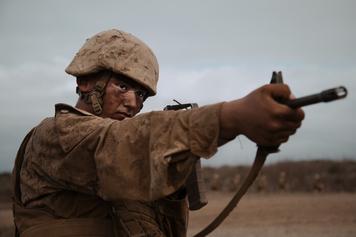 U.S. Marine Corps Recruit Julian Sandoval with Mike Company, 3rd Recruit Training Battalion, sights in with his rifle during a Crucible event at Marine Base Camp Pendleton, California, Oct. 23, 2023. The Crucible is a 54-hour exercise where recruits apply the knowledge and training they've learned throughout recruit training to earn the title of a United States Marine. Sandoval was recruited out of Recruiting Station San Jose, California.  (U.S. Marine Corps photo by Cpl. Elliott A. Flood-Johnson)