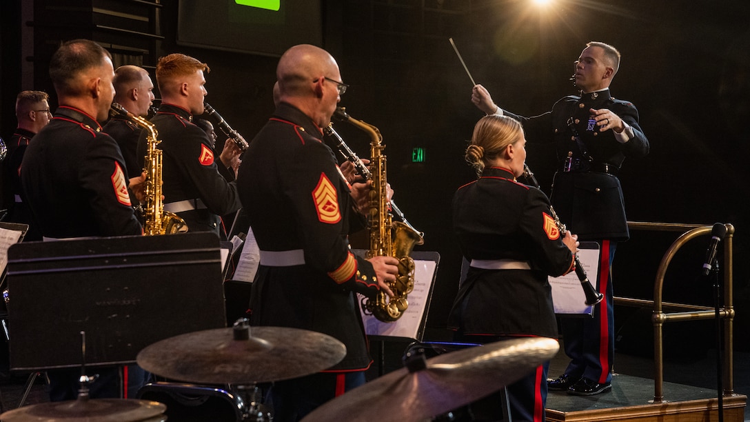 U.S. Marine Corps Warrant Officer Nathan Doggett, right, director of the 2nd Marine Aircraft Wing (MAW) Band, leads the band during the 34th Annual Vincent Vizzo Columbus Day Concert at Bridgeport, Connecticut, Oct. 6, 2023. Marines with the 2nd MAW Band performed during the 34th Annual Vincent Vizzo Columbus Day Concert to strengthen community relationships and reaffirm history, customs, and traditions representative of the United States Marine Corps to those in attendance. 2nd MAW is the aviation combat element of II Marine Expeditionary Force. (U.S. Marine Corps photo by Lance Cpl. Orlanys Diaz Figueroa)