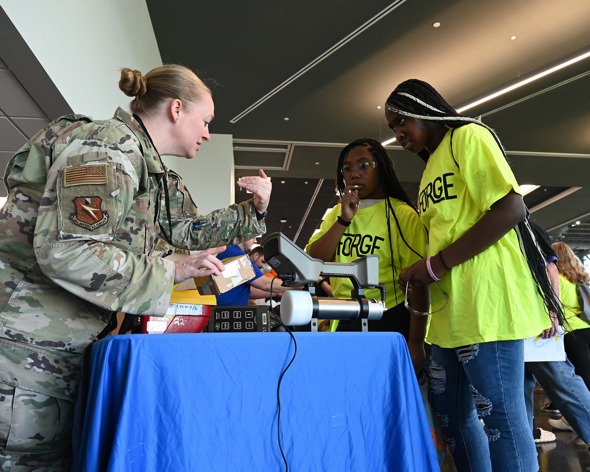 Tech. Sgt. Kristen Nickerson, 14th Civil Engineering Squadron flight chief bioenvironmental, describes equipment she uses in her career field to students during a career day event hosted by FORGE at East Mississippi Community College on October 25,2023.