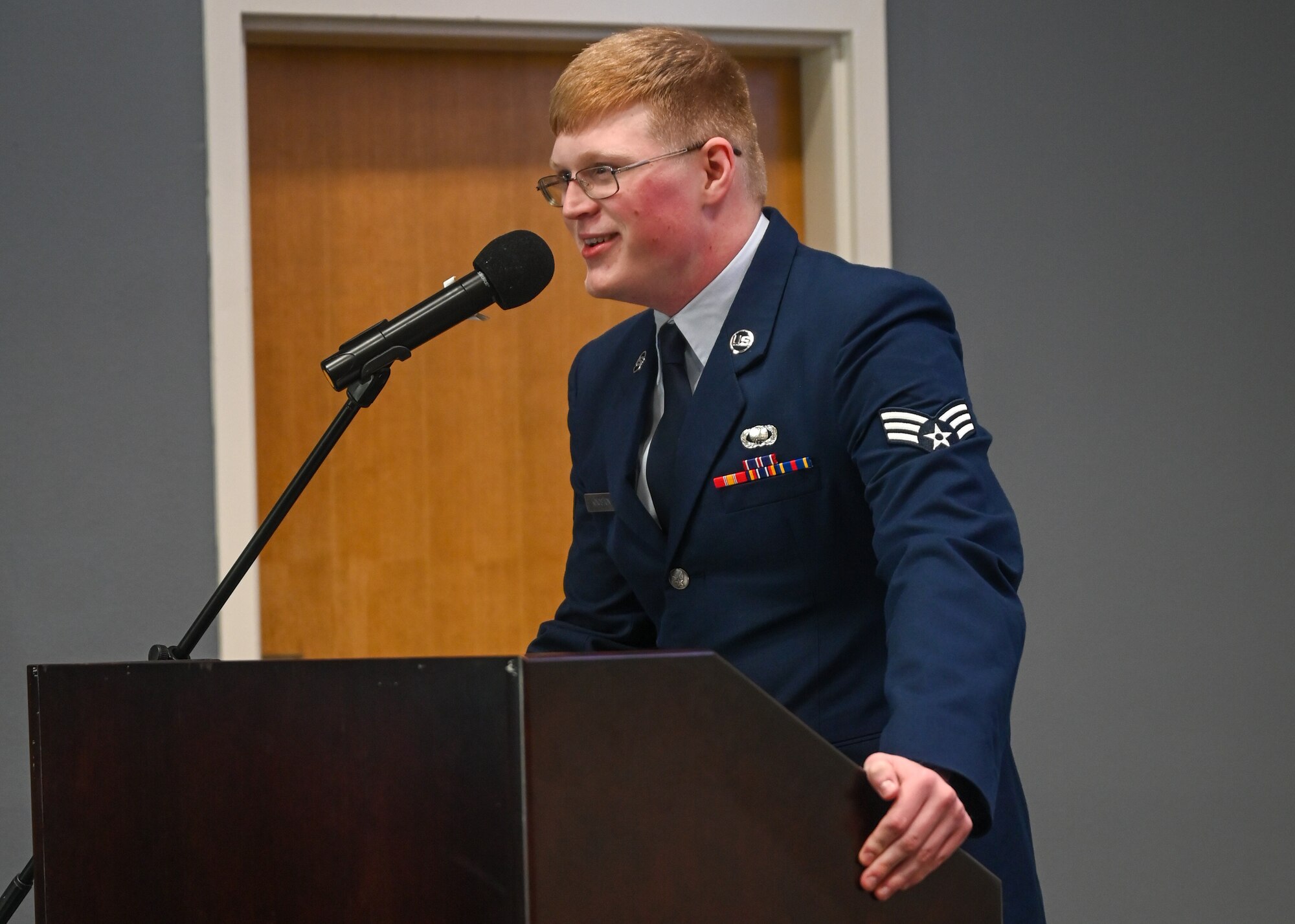 U.S. Air Force Senior Airman Davis Kingston, Class 23-G Airman Leadership School graduate, delivers the class speech during the Class 23-G ALS graduation at the Powell Event Center, Goodfellow Air Force Base, Texas, Oct. 26, 2023. Kingston recounted time spent with his class and shared stories of their camaraderie. (U.S. Air Force photo by Airman 1st Class Zach Heimbuch)