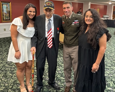 Commanding General Maj. Gen. Paul Stanton stands with WWII veteran Louis Graziano along with his daughter Hannah and wife Nomi after the redesignation ceremony naming Fort Eisenhower Oct. 27, 2023.