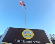 A mock up of the Gate to Fort Eisenhower is displayed by the command flag pole near Barton Field on Oct. 26, 2023 prior to the redesignation ceremony the following day.