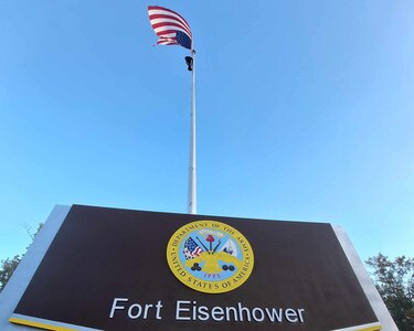 A mock up of the Gate to Fort Eisenhower is displayed by the command flag pole near Barton Field on Oct. 26, 2023 prior to the redesignation ceremony the following day.