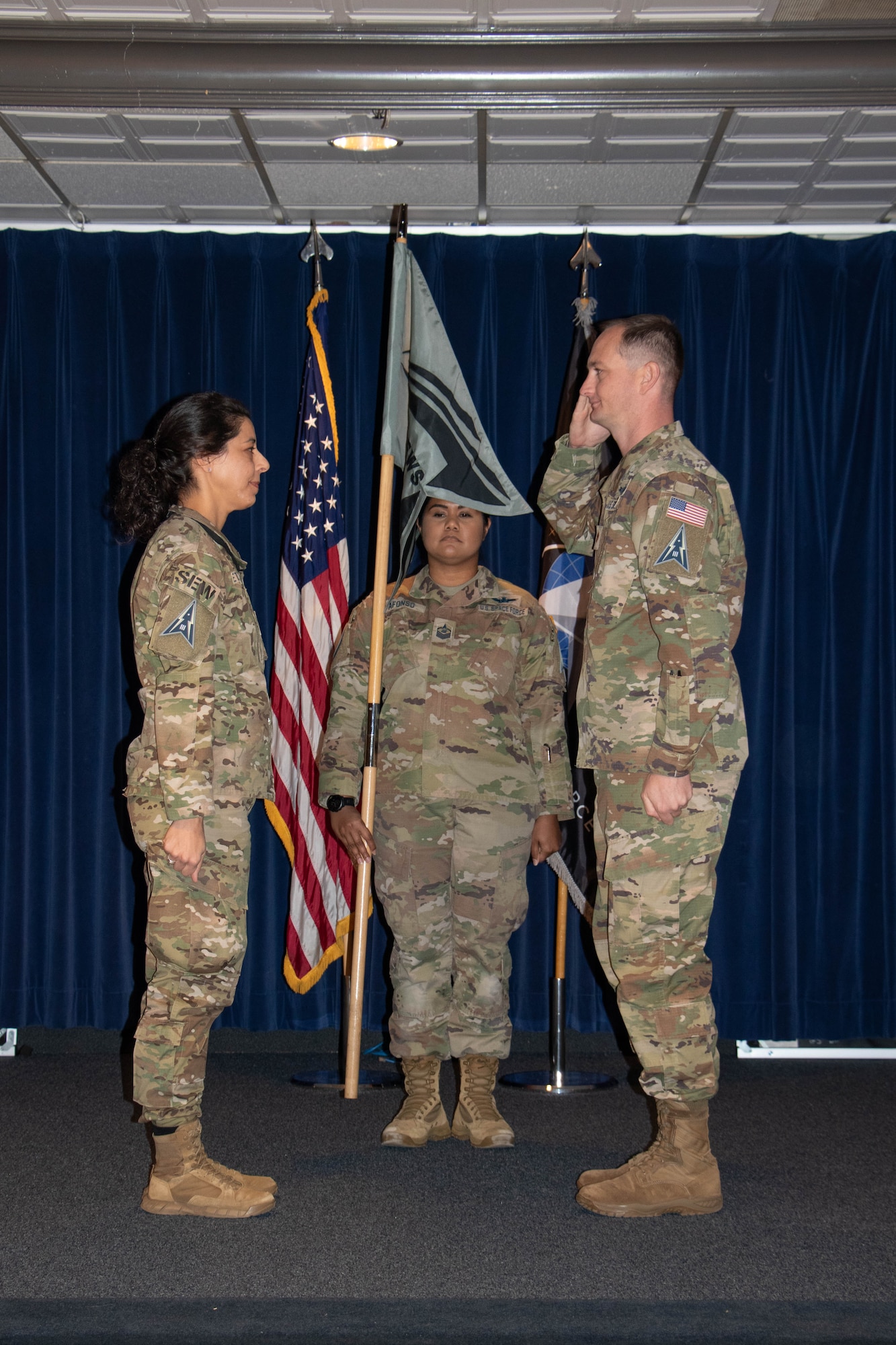 U.S. Space Force Maj. Zachary Scoggins, commander of the 23rd Electromagnetic Warfare Squadron (right), salutes Col. Nicole Petrucci, commander of Space Delta 3 – Space Electromagnetic Warfare (left), during the 23rd EWS’s activation ceremony on Peterson Space Force Base, Colorado, Oct. 16, 2023.  The 23rd EWS became the 5th squadron to fall under DEL 3. (U.S. Space Force photo by Emily Peacock)