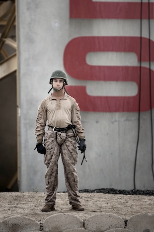 U.S. Marine Corps Pvt. Angel RomeroHurtado, with Hotel Company, 2nd Recruit Training Battalion, Marine Corps Recruit Depot San Diego, poses in front of the rappel tower, at MCRD San Diego, Oct. 27, 2023. The rappel tower was conducted to build confidence within new Marines and prepare them for future training and overcoming difficult situations. RomeroHurtado, recruited out of Grand Junction, Colorado, stated the rappel tower helped him overcome his fear of heights and gain confidence within himself. (U.S. Marine Corps photo by Sgt. Yvonna Guyette)