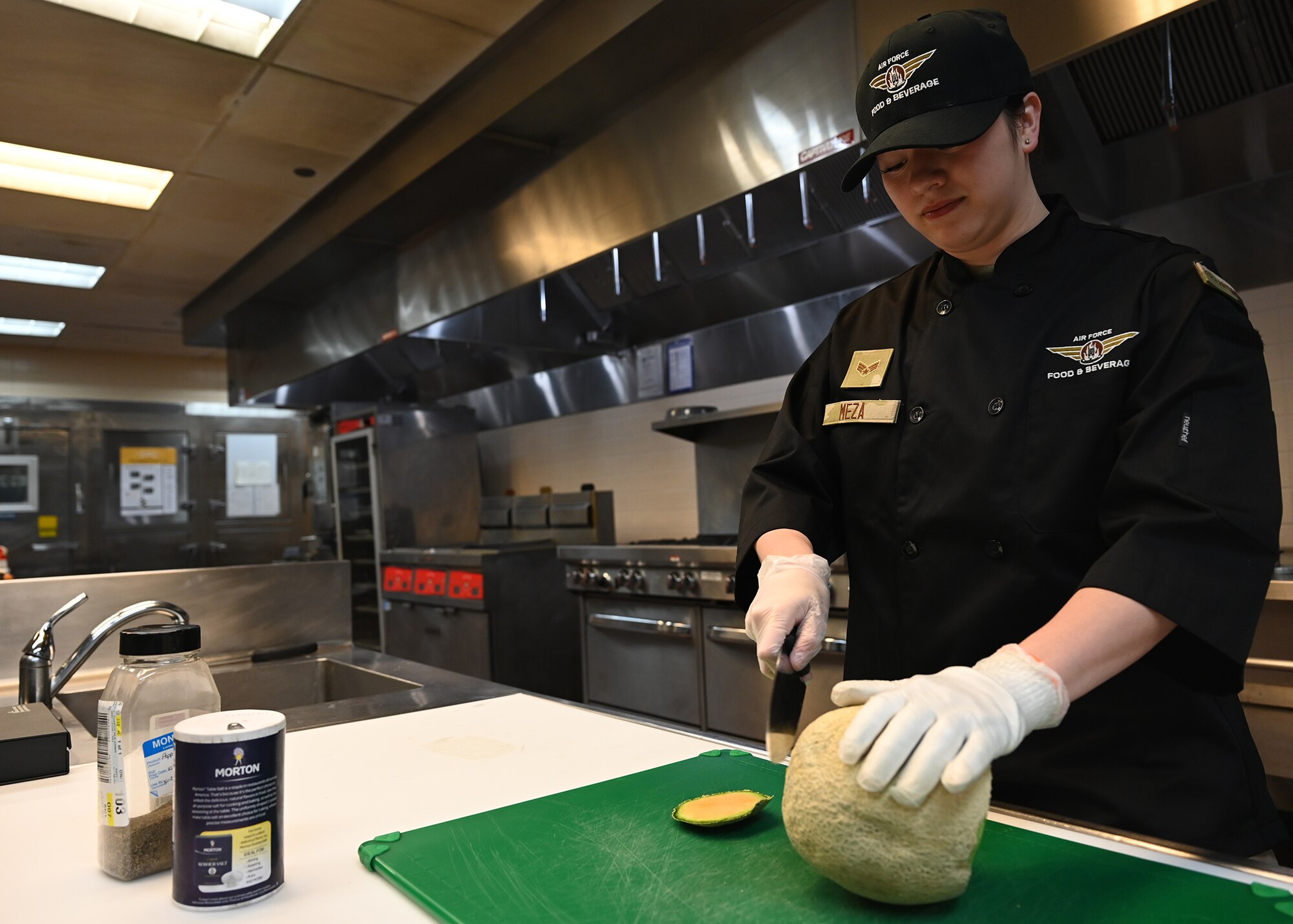 airman cutting a melon