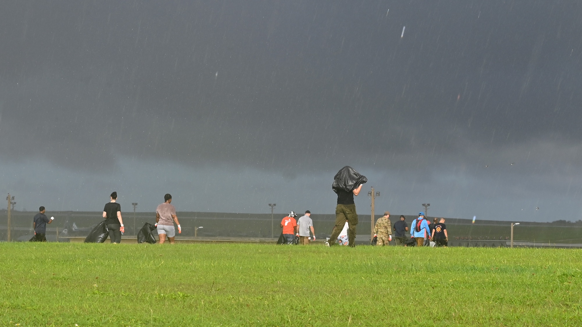 U.S. Air Force Airmen assigned to the 36th

Wing search the grass for debris from

Typhoon Mawar at Andersen Air Force Base,

Guam, Oct. 25, 2023.