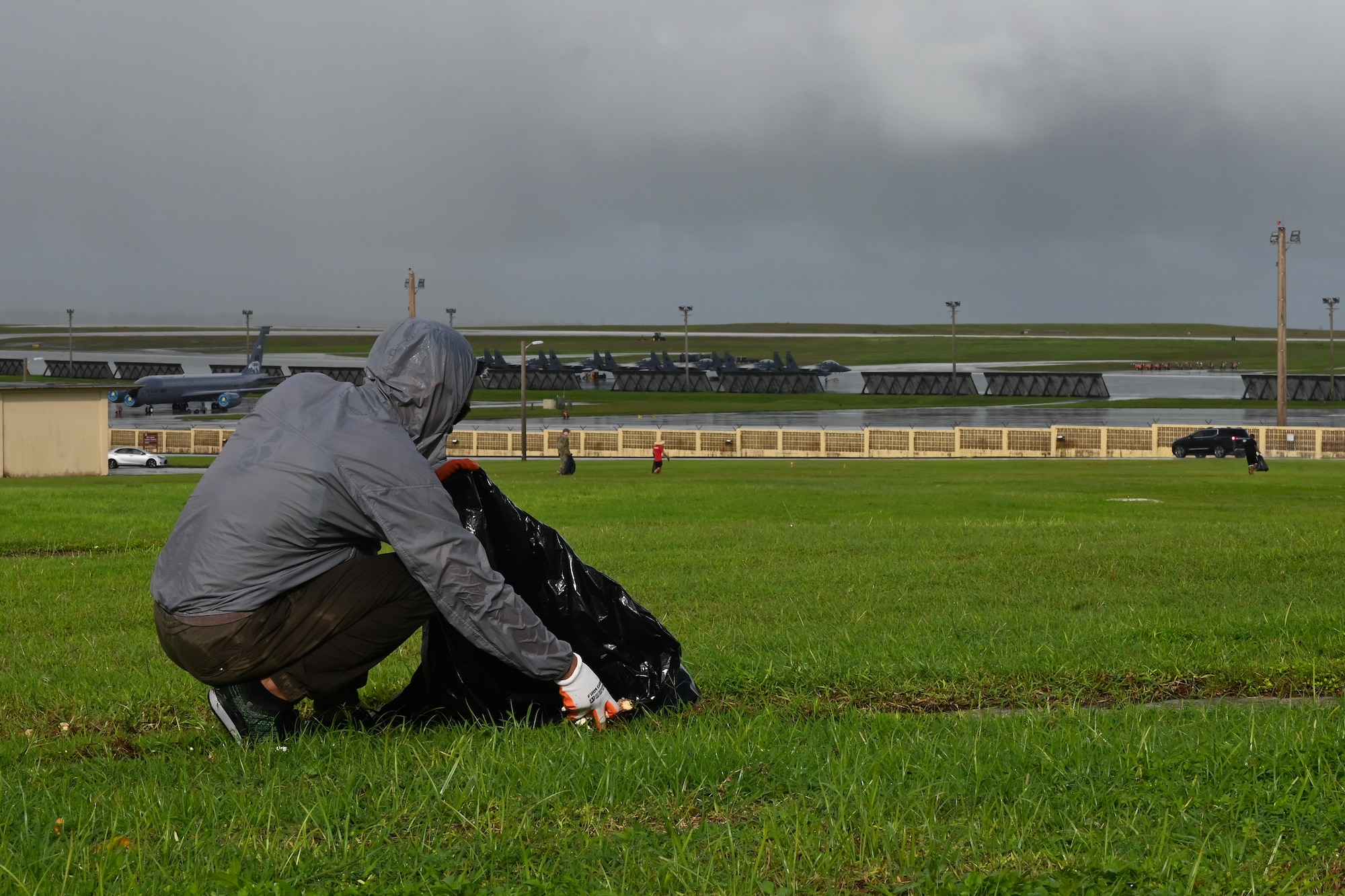 A U.S. Air Force Airman assigned to the 36th

Wing picks up debris at Andersen Air Force

Base, Guam, Oct. 25, 2023.