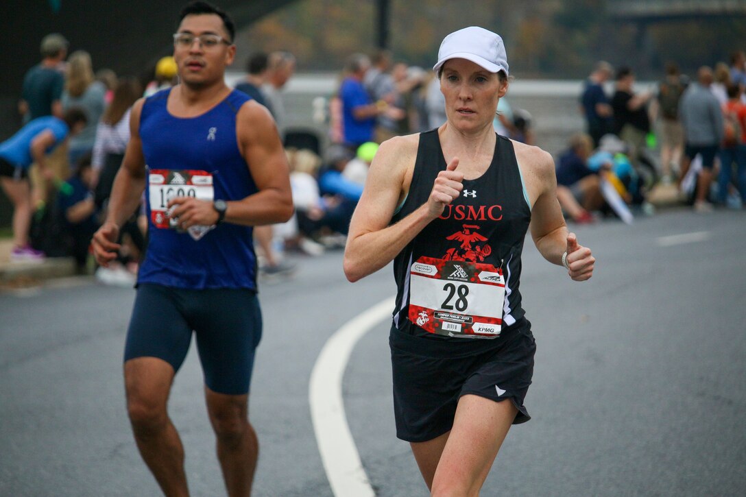 Marine Corps Capt. Mollie Geyer of Camp Pendleton, California on the course and on her way to bronze during the 2023 Armed Forces Marathon Championship held in conjunction with the 48th Marine Corps Marathon in Washington, D.C.  The Armed Forces Championship features teams from the Army, Marine Corps, Navy (with Coast Guard runners), and Air Force (with Space Force Runners).  Department of Defense Photo by Mr. Steven Dinote - Released.