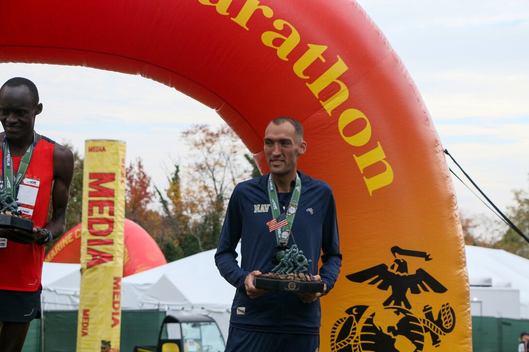 Navy Lt. Cmdr Patrick Hearn of Pearl Harbor Naval Shipyard, Hawaii takes second overall in the Men's Division of the Marine Corps Marathon.  The 2023 Armed Forces Marathon Championship held in conjunction with the 48th Marine Corps Marathon in Washington, D.C.  The Armed Forces Championship features teams from the Army, Marine Corps, Navy (with Coast Guard runners), and Air Force (with Space Force Runners).  Department of Defense Photo by Mr. Steven Dinote - Released.