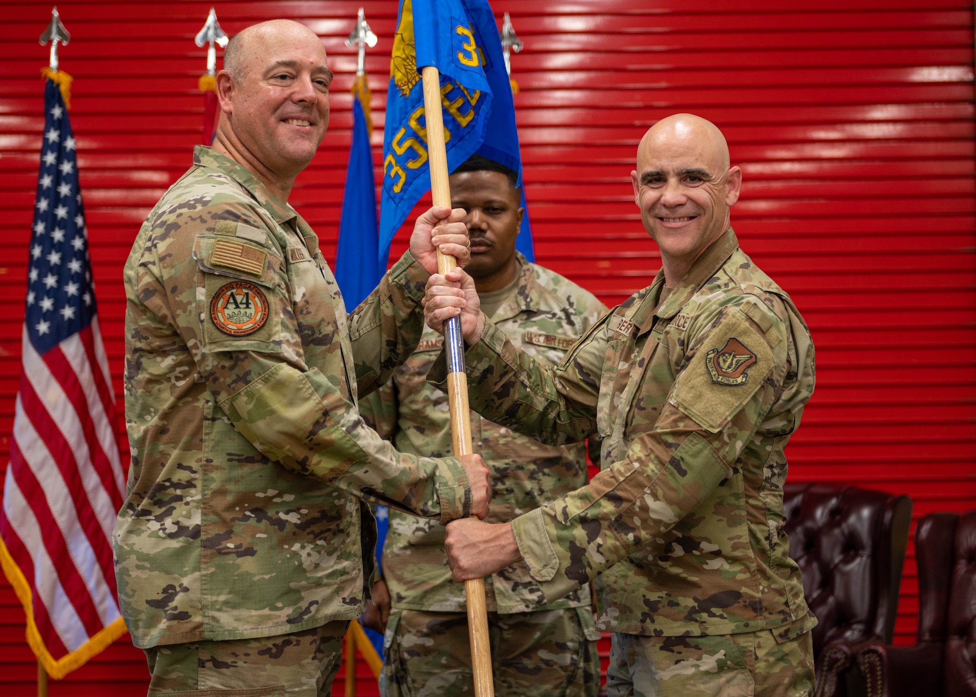 U.S. Air Force Col. Adam Roberts, commander of the 356th Expeditionary Civil Engineer Group, receives the guidon from Brig. Gen. Patrick G. Miller, director of logistics, engineering and force protection, headquarters Pacific Air Forces, Joint Base Pearl Harbor Hickam, Hawaii, at the Pacific Regional Training Center - Andersen, Guam,  Oct. 20, 2023. Roberts is now responsible for leading the 356th ECEG. (U.S. Air Force photo by Airman Allon Lapaix)
