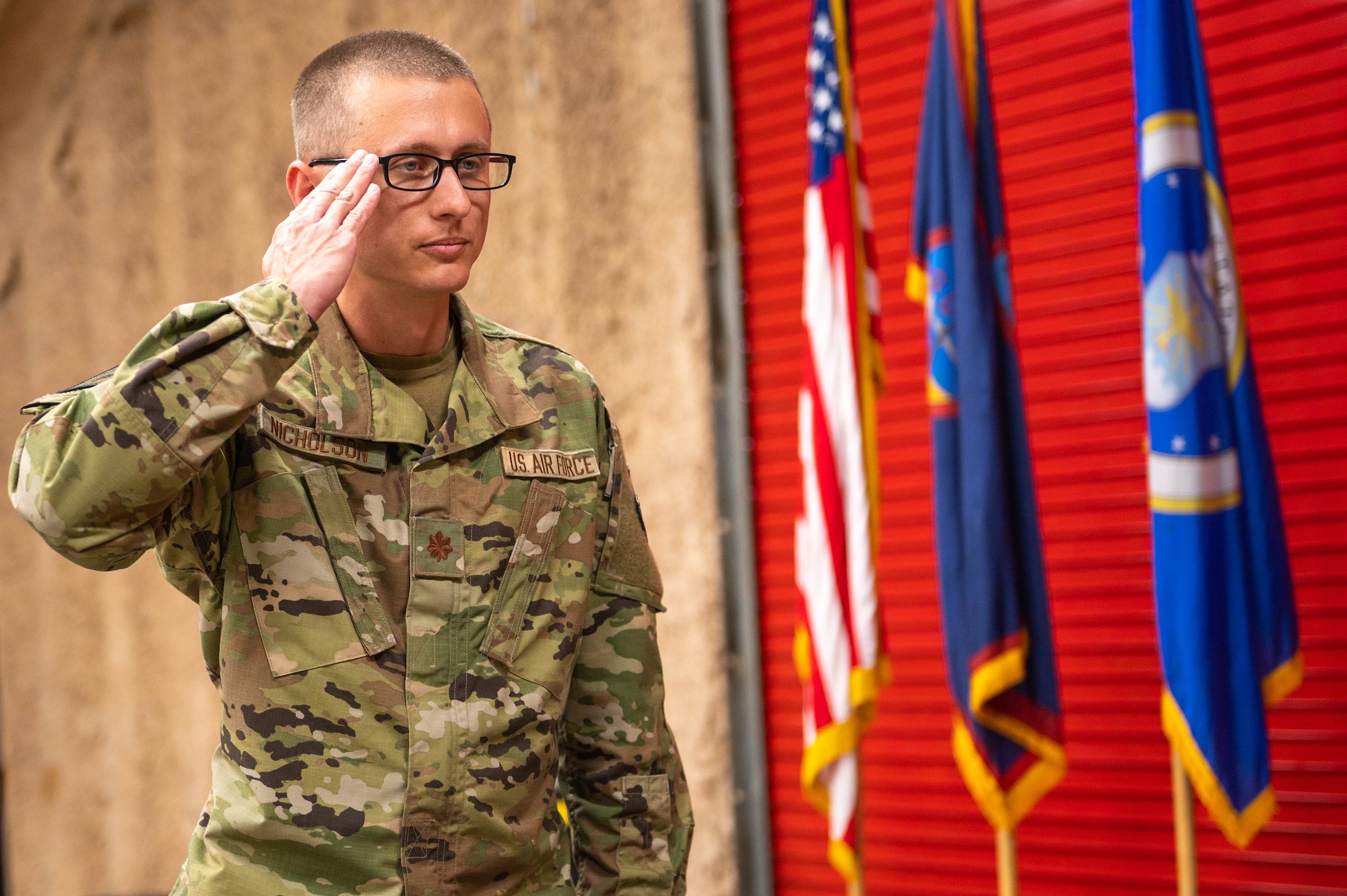 U.S. Air Force Maj. Chrystopher Nicholson, commander of the 513th Rapid Engineer Deployable Heavy Operations Repair Squadron Engineers Squadron, renders his first salute to his squadron at the Pacific Regional Training Center – Andersen, Guam, Oct. 20, 2023. Nicholson is now responsible for leading the RHS. (U.S. Air Force photo by Airman Allon Lapaix)