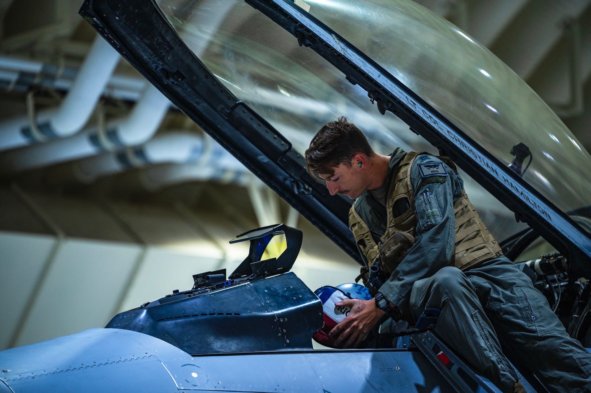 Capt. Jacob Yarnell boards an F-16 Fighting Falcon during Vigilant Defense