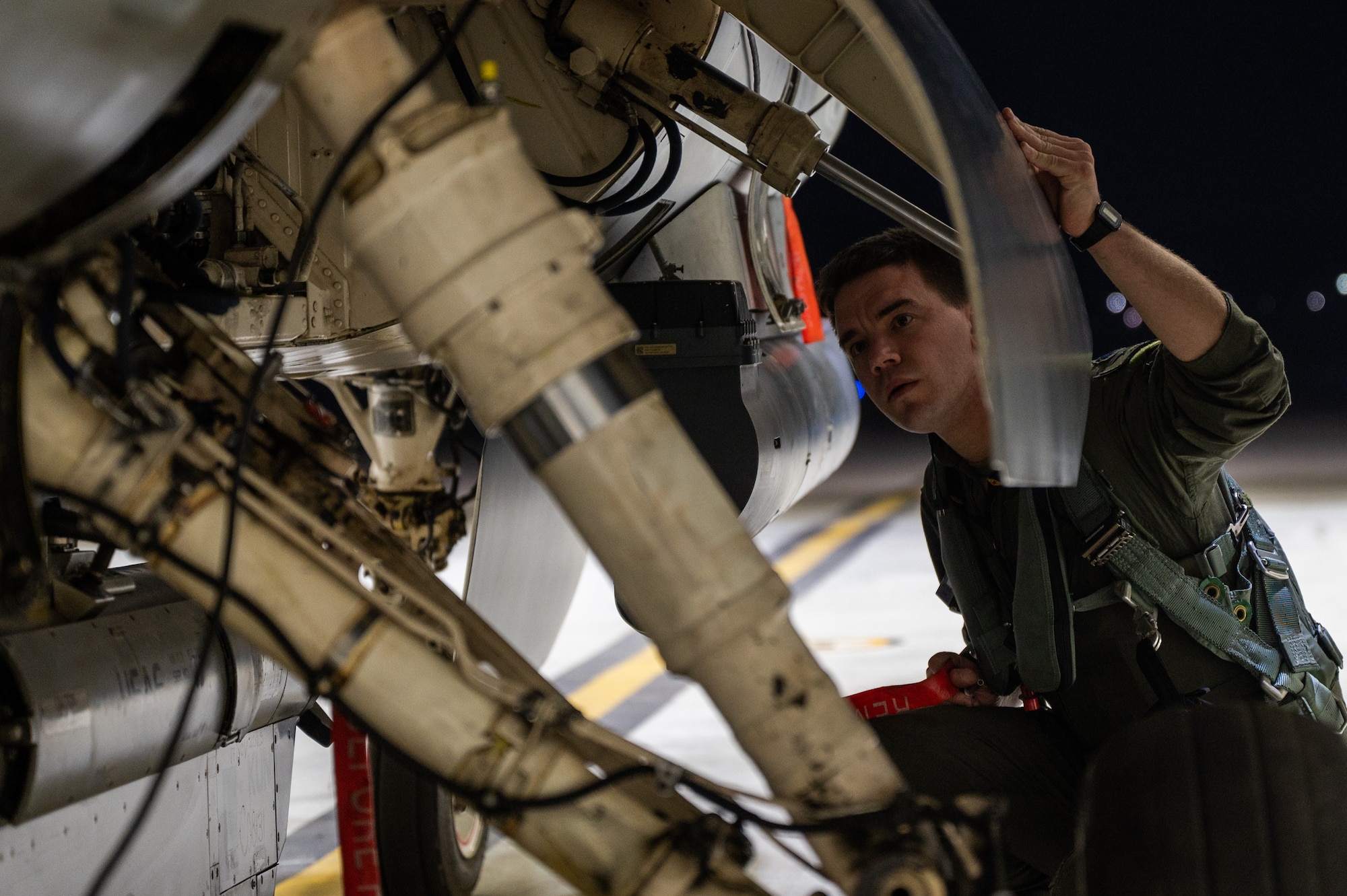 Capt. Patrick Oshea inspects a F-16 Fighting Falcon during Vigilant Defense.