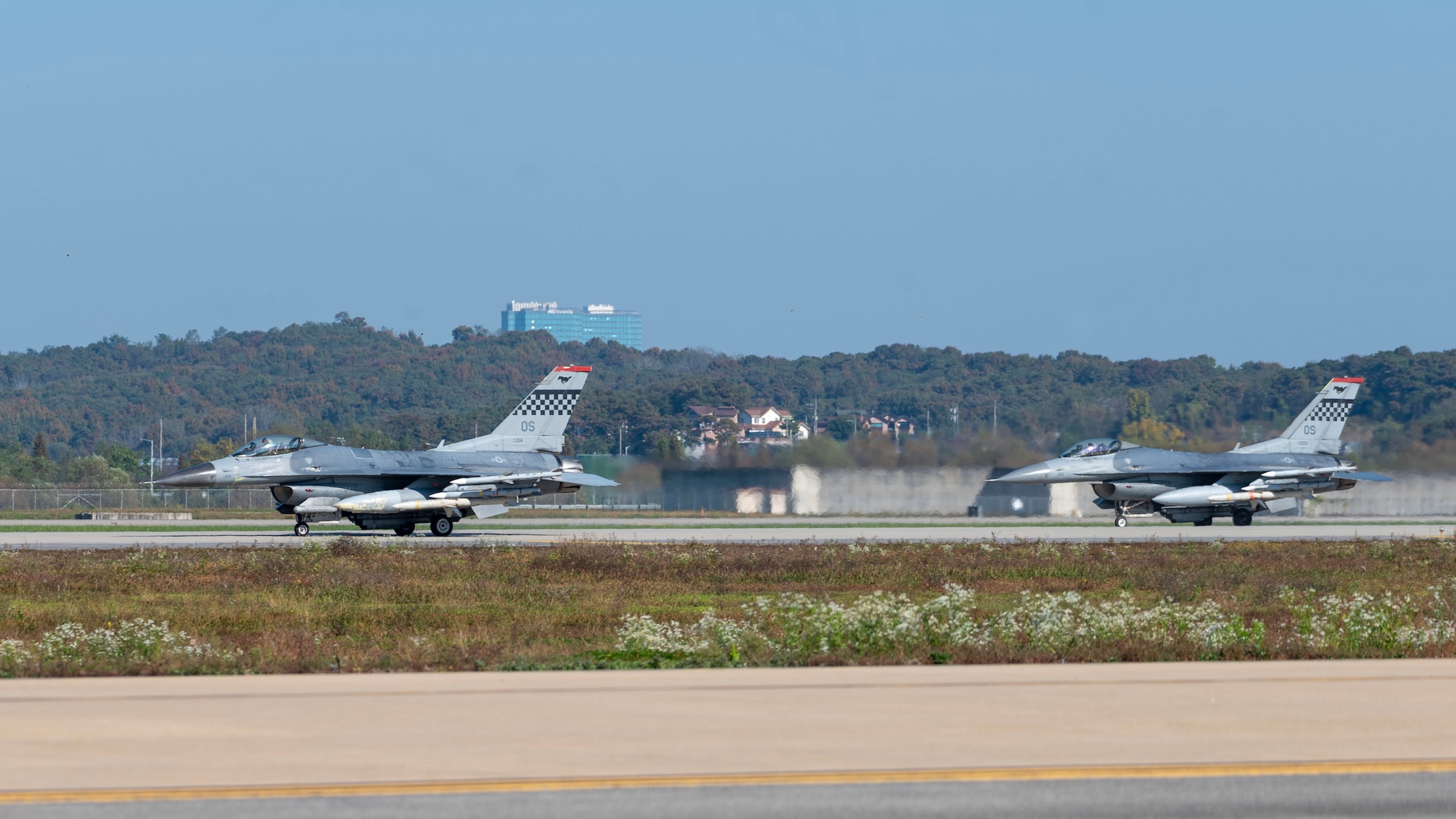 F-16 Fighting Falcons from the 36th Fighter Squadron, taxi the runway during Vigilant Defense 24 at Osan Air Base, Republic of Korea, Oct. 29, 2023. The aircraft generation demonstrated the 51st Fighter Wing’s rapid generation capabilities and response readiness, ensuring the wing remains ready to “Fight Tonight”. VD24 is a routine training event that tests the military capabilities across the peninsula, allowing combined and joint training at both the operational and tactical levels. (U.S. Air Force photo by Staff Sgt. Aubree Owens)