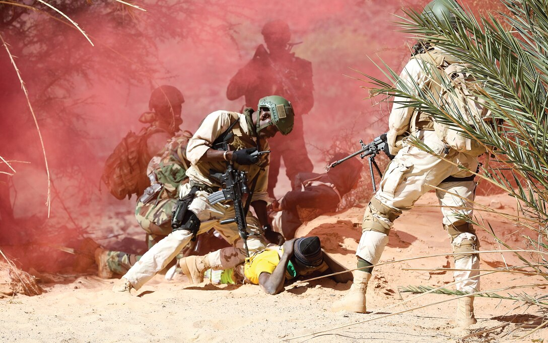 Senegalese soldier secures enemy combatant during simulated raid conducted after gathering intelligence in pursuit of malign actors as part of Flintlock 20 scenario, near Atar, Mauritania, on February 26, 2020