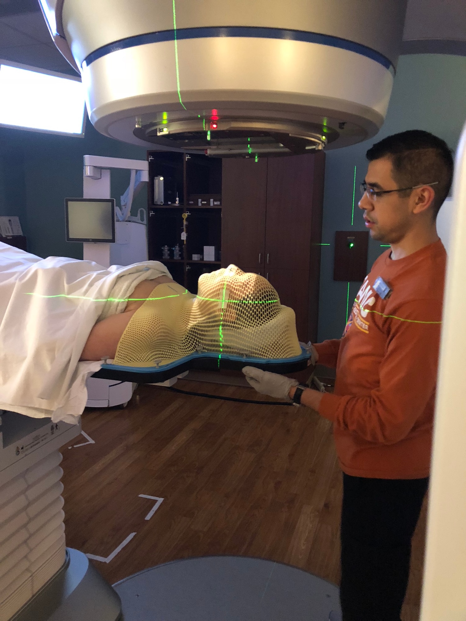 U.S. Air Force Tech. Sgt. Nicole Favuzza, 93rd Intelligence Squadron section chief of reports, receives an x-ray, Aug. 22, 2018, at San Antonio Military Medical Center, Joint Base San Antonio-Fort Sam Houston, Texas. Favuzza was diagnosed with Adenoid Cystic Carcinoma, a rare and incurable form of cancer. According to the National Organization for Rare Disorders report, July 6, 2023, symptoms of ACC of the salivary glands may include numbness of the lower lip and/or other facial areas; nerve impairment causing weakness of certain facial muscles; ongoing pain; and/or other associated abnormalities. (Courtesy photo)