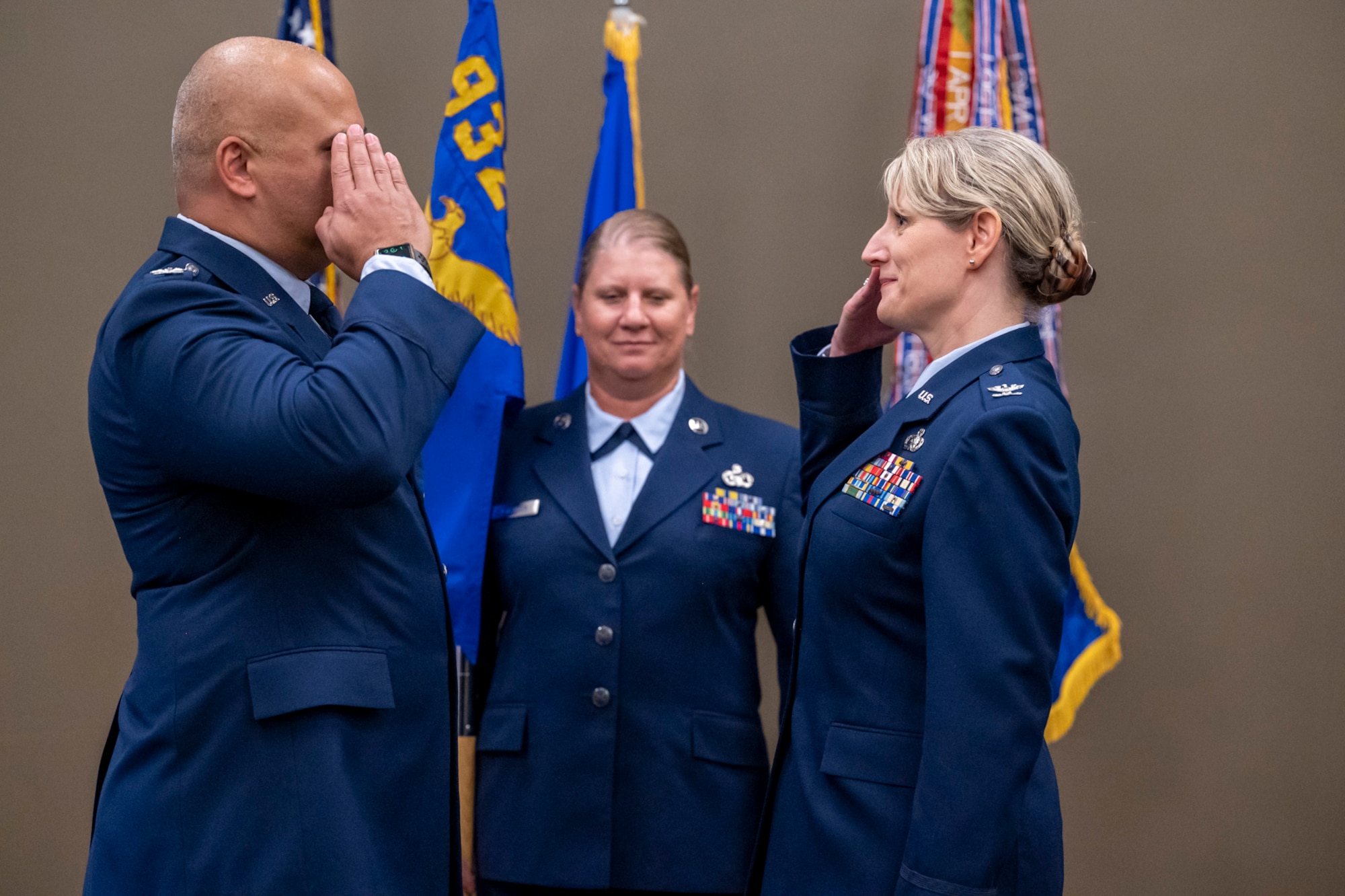 Col. Jeffrey Smith, 932nd Airlift Wing commander, returns a salute to Col. Dori Mansur, 932nd Mission Support Group commander, during Mansur's Assumption of Command ceremony, Oct. 14th, 2023, Scott Air Force Base, Illinois. (U.S. Air Force photo by Senior Airman Jonathan Stefanko)