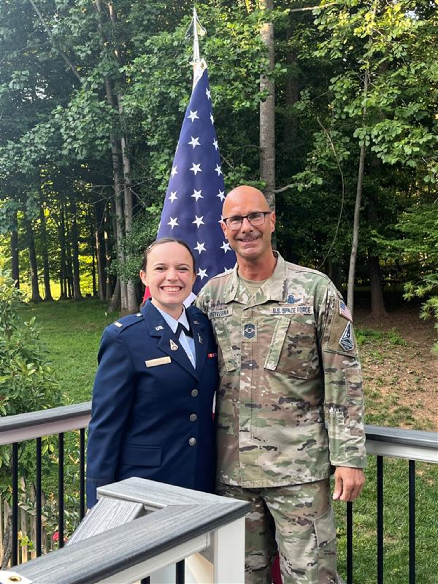 U.S. Space Force 2nd Lt. Josephine Lerner stands with Chief Master Sgt. of the Space Force John F. Bentivegna after administering the oath of office during his Reenlistment Ceremony on August 19, 2023, in Manassas, Virginia.