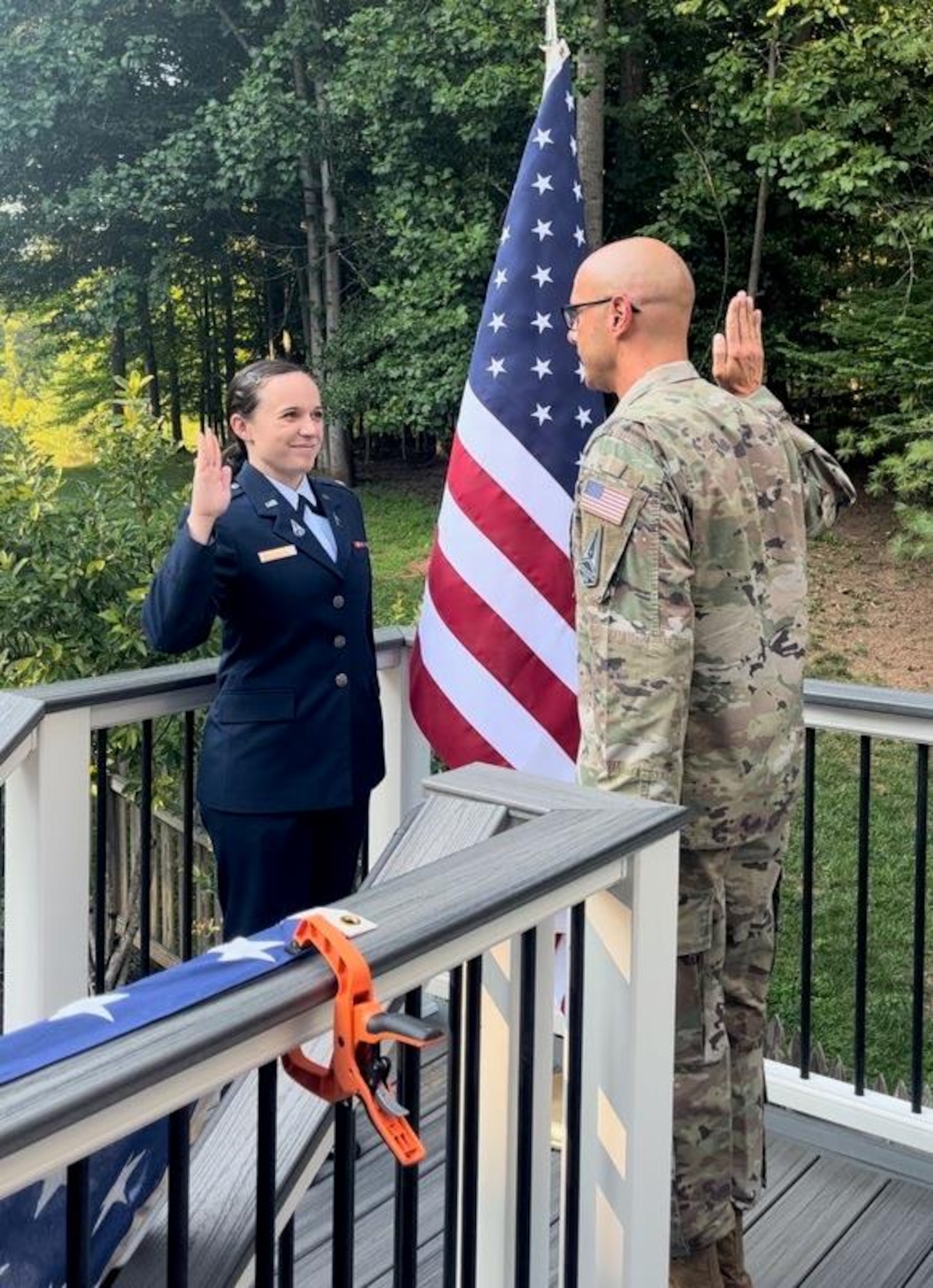 U.S. Space Force 2nd Lt. Josephine Lerner administers the oath of office for Chief Master Sgt. of the Space Force John F. Bentivegna during his Reenlistment Ceremony on August 19, 2023, in Manassas, Virginia