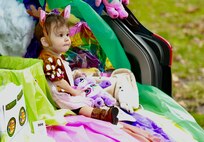 Little reindeer 9-month-old Renee Bauer sits in the back of a trunk during the Illinois National Guard Family Programs "Trunk or Treat" on Oct. 28 on Camp Lincoln in Springfield, Illinois. The Illinois National Guard is also holding a Trunk or Treat for military families on Sunday, Oct. 29, 1-4 p.m., at the North Riverside Armory, 8660 W. Cermak Road, North Riverside, Illinois. The Trunk or Treat is a family and pet-friendly event open to servicemembers, veterans and their families throughout Chicagoland area. There will be costume contests with prizes for adults, children, and pets.