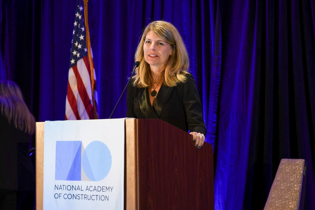 Woman speaks at a podium
