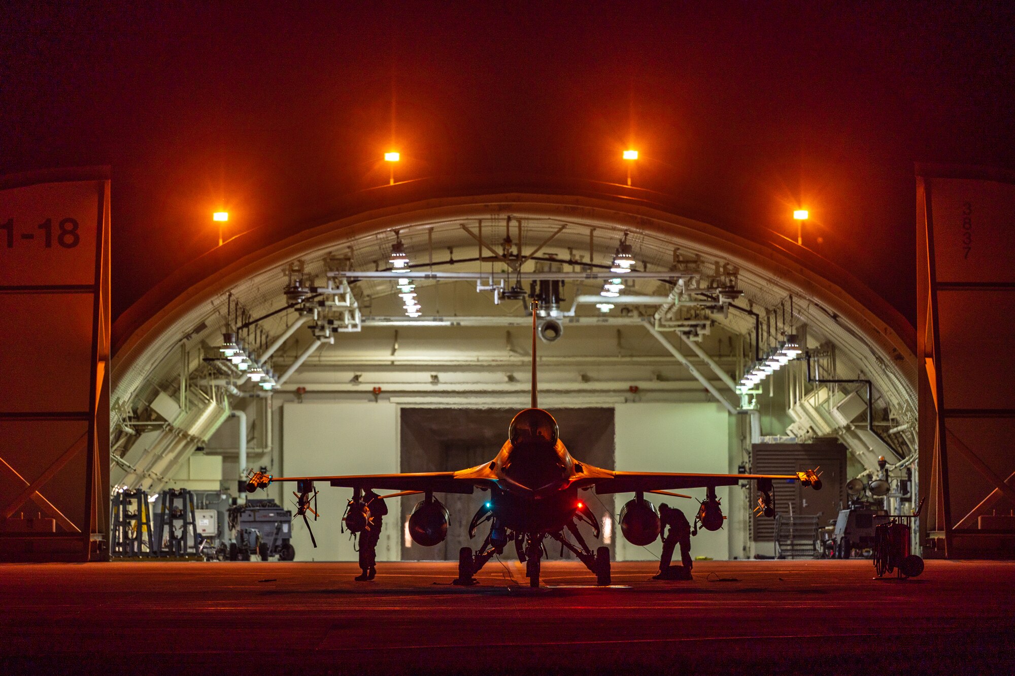 80th Fighter Generation Squadron Airmen observe an F-16 Fighting Falcon while conducting preflight systems inspections.
