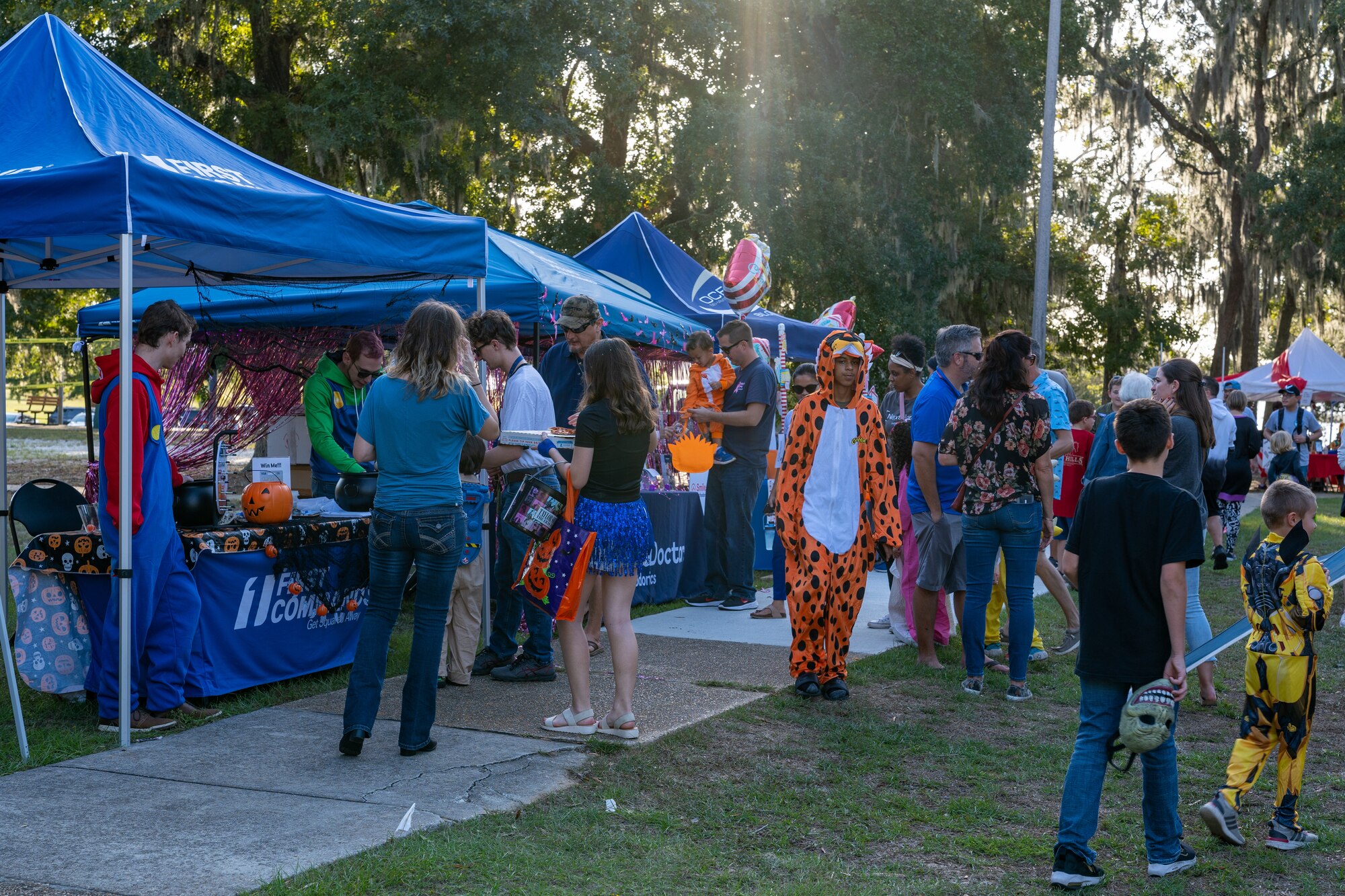 U.S. Airmen and their families go trick or treating during Ghouls in the Park at Keesler Air Force Base, Mississippi, Oct. 27, 2023.