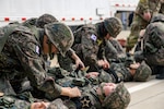 Korean Augmentation to the U.S. Army reserve Soldiers conduct first aid training on U.S. Army Garrison Humphreys, South Korea, Oct. 25, 2023. These KATUSA Soldiers have completed their mandatory service obligation to the Republic of Korea Army, but must undergo periodic refresher training on their wartime mission. (U.S. Army photo by Cpl. Choi, Kang Min)