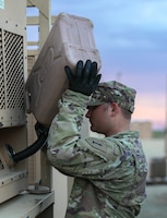 U.S. Army Private First Class Cameron Boarts, a human intelligence collector assigned to Signal Intelligence and Sustainment Company, Headquarters and Headquarters Battalion, 1st Infantry Division, pours fuel to begin the first day of operation Danger Ready 2 on Fort Riley, Kansas, Oct. 23, 2023. Danger Ready 2 is the second phase in the Danger Ready series which further prepares Soldiers for deployment. (U.S. Army photo by Spc. Dawson Smith)
