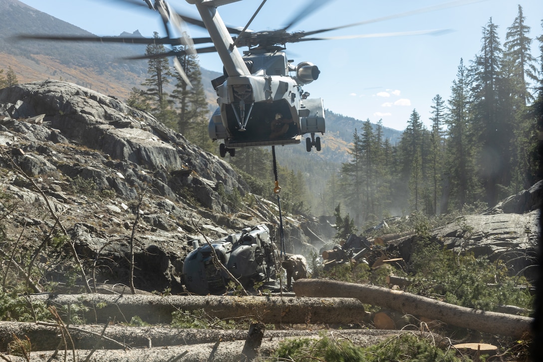 U.S. Marines with Marine Heavy Helicopter Squadron (HMH) 461 and 2nd Distribution Support Battalion (DSB) execute the lift of a downed U.S. Navy MH-60S Seahawk at Inyo National Forest, California, Oct. 20, 2023. The combined efforts of U.S. Marines, Sailors, and Forest Service personnel allowed HMH-461 to successfully recover an MH-60S Seahawk with a CH-53K King Stallion. HMH-461 is a subordinate unit of the 2nd Marine Aircraft Wing, and 2nd DSB is a subordinate unit of the 2nd Marine Logistics Group, the aviation and logistics combat elements of the II Marine Expeditionary Force. (U.S. Marine Corps photo by Cpl. Rowdy Vanskike)