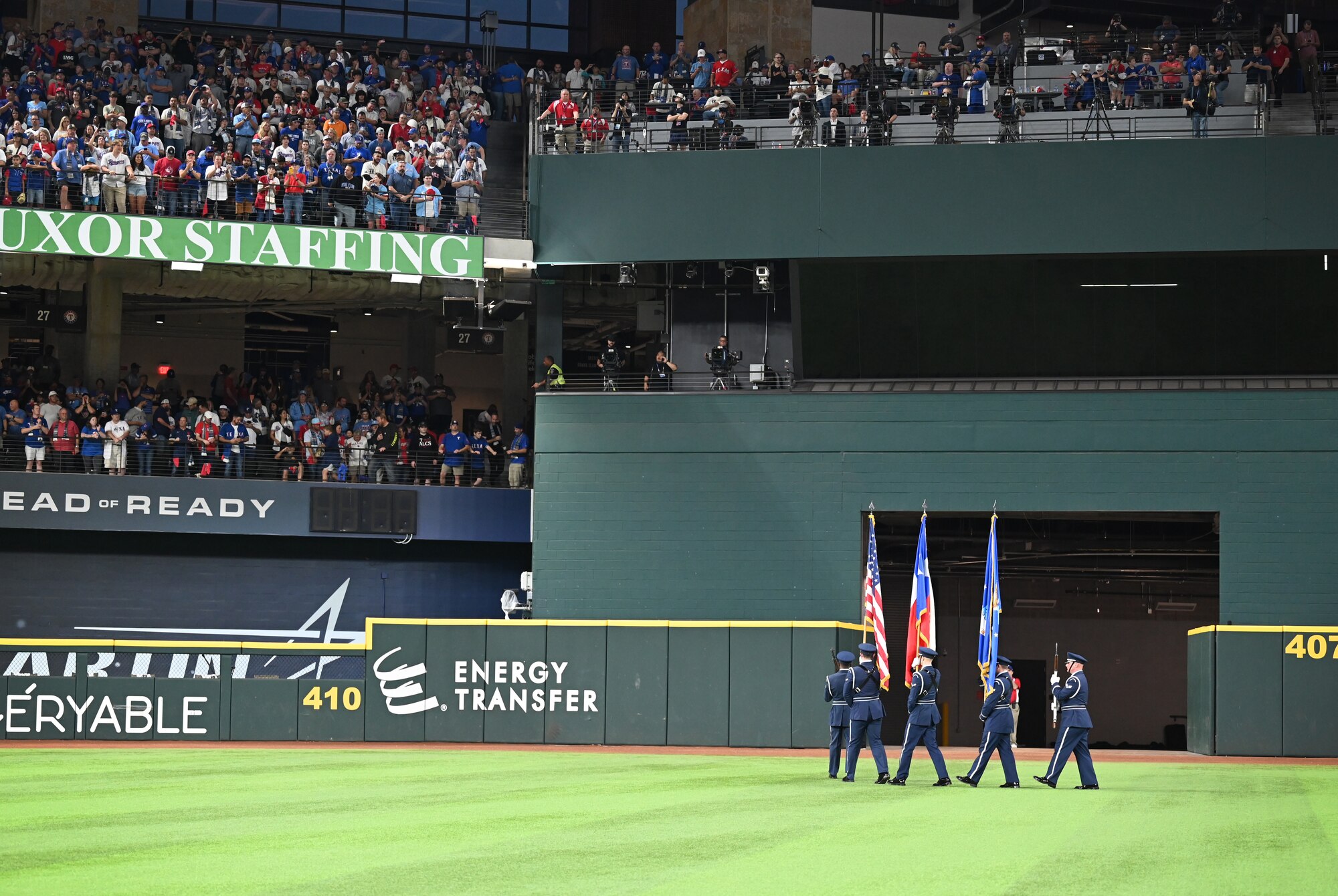 The Dyess Honor Guard exits the field after the national anthem during the World Series opening game at Globe Life Field in Arlington, Texas, Oct. 27, 2023. This was the first time Dyess Honor Guardsmen have presented the colors during a Texas Rangers World Series game and the first time since 2011 since the Rangers have played in a World Series game. (U.S. Air Force photo by Staff Sgt. Holly Cook)