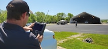 A man uses a remote control.