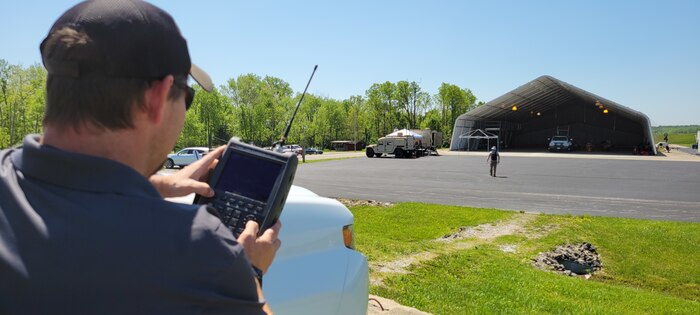 A man uses a remote control.