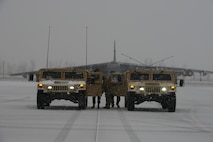 Defenders with the 5th Security Forces Squadron defenders converse outside of their vehicles during Exercise Prairie Vigilance 24-1 at Minot Air Force Base, North Dakota, Oct. 23, 2023. Prairie Vigilance develops Airmen and aircrew, steadily increasing their skillset and improving mission readiness. (U.S. Air Force photo by Airman 1st Class Trust Tate)