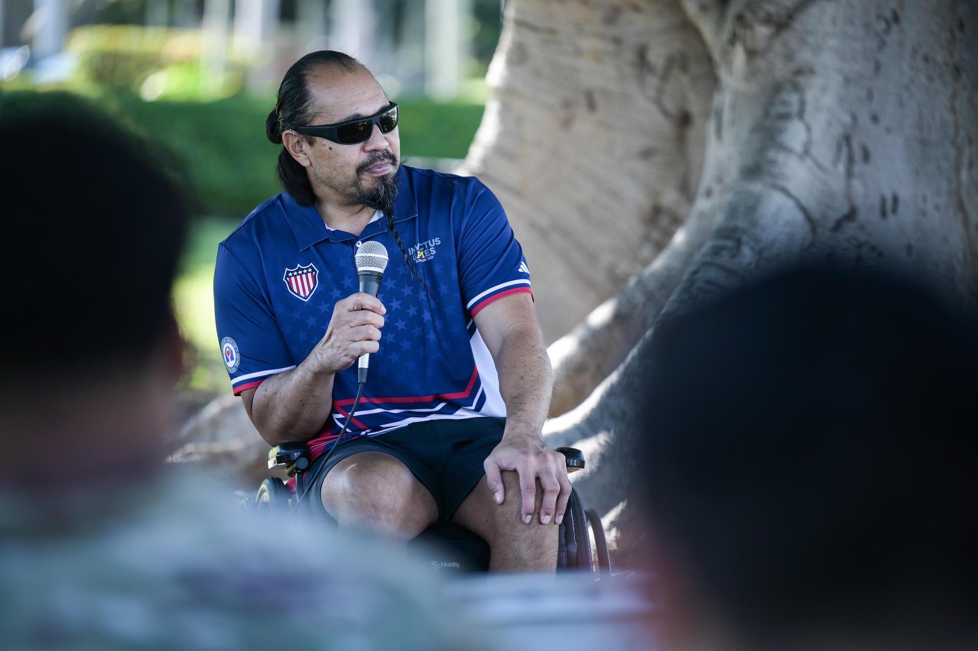 Ret. Chief Master Sgt. Garrett Kuwada, Team U.S.A. athlete, shares his life experiences during a National Disability Awareness event at Joint Base Pearl Harbor-Hickam, Hawaii, Oct. 26, 2023. Kuwada shared his life altering experience while encouraging others with disabilities to not limit themselves. (U.S. Air Force photo by Staff Sgt. Alan Ricker)