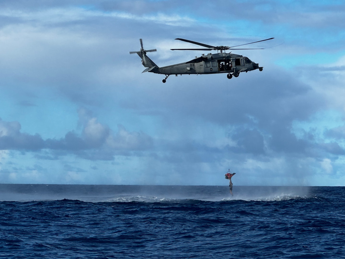 Following search patterns designed by the U.S. Coast Guard Forces Micronesia/Sector Guam Joint Rescue Sub-Center team, U.S. Navy Helicopter Sea Combat Squadron Two-Five personnel, using an MH-60 Knighthawk helicopter, located the three divers a few miles from their original location  off Santa Rosa Banks off Guam at about 3:45 p.m. on Oct. 28, 2023, and performed a successful hoist operation, ensuring their safe rescue. U.S. Coast Guard Station Apra Harbor using a 45-foot Response Boat-Medium also responded. (U.S. Coast Guard photo by Petty Officer 2nd Class Menet)