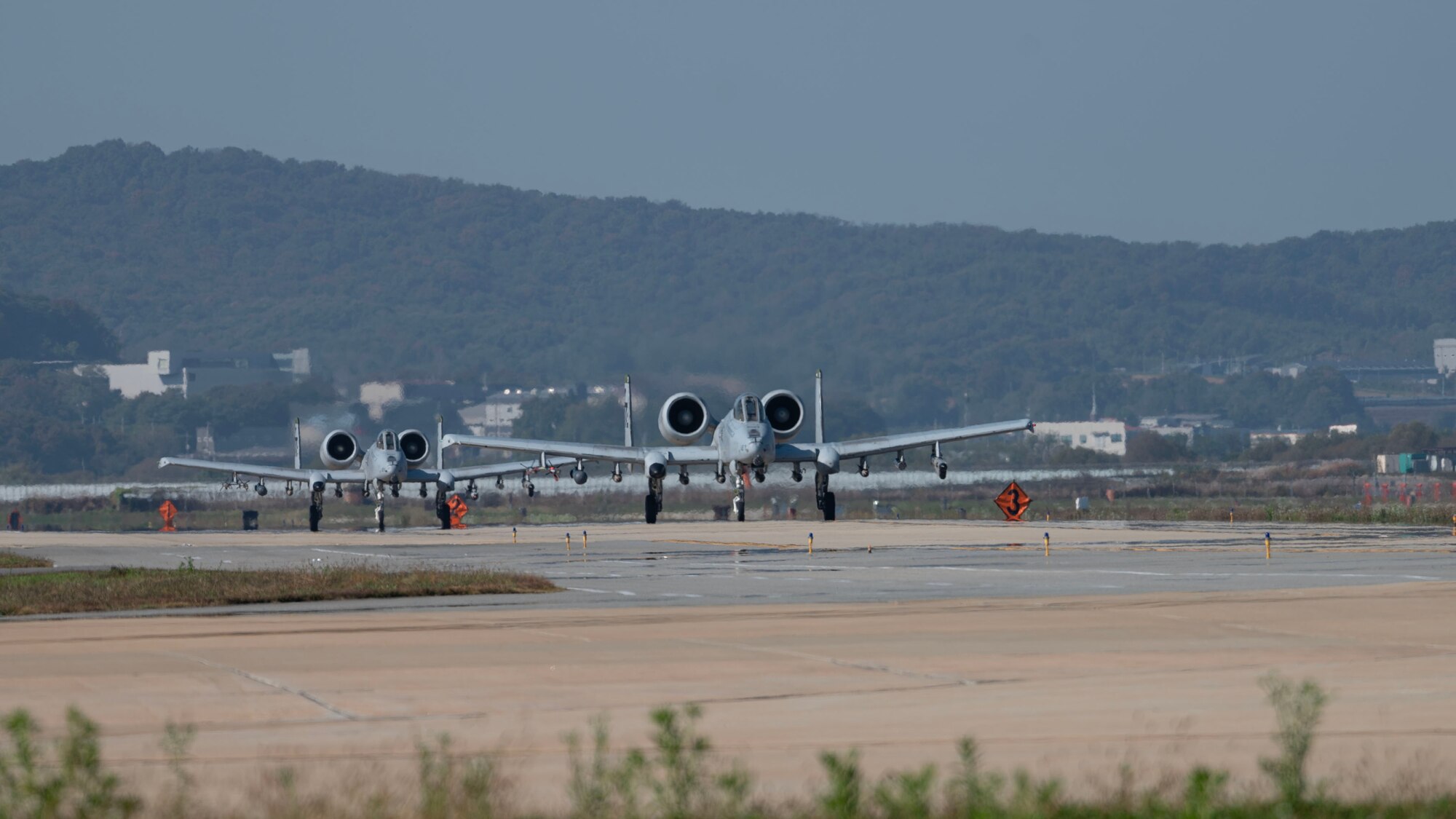 A-10C Thunderbolt IIs from the 25th Fighter Squadron, taxi the runway during Vigilant Defense 24 at Osan Air Base, Republic of Korea, Oct. 29, 2023. The aircraft generation demonstrated the 51st Fighter Wing’s rapid generation capabilities and response readiness, ensuring the wing remains ready to “Fight Tonight”. VD24 is a routine training event that tests the military capabilities across the peninsula, allowing combined and joint training at both the operational and tactical levels. Training is conducted throughout the year to generate combat airpower at a moment’s notice, affirming the commitment to the ROK remains ironclad and ensures regional stability throughout the Indo-Pacific. (U.S. Air Force photo by Staff Sgt. Aubree Owens)