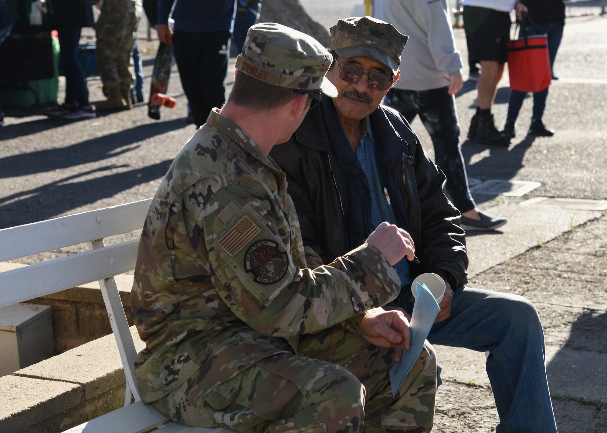 A service member from Vandenberg Space Force Base speaks to a local veteran at the 2023 Santa Barbara County Veterans Stand Down Day in Santa Maria, Calif., Oct. 28, 2023.