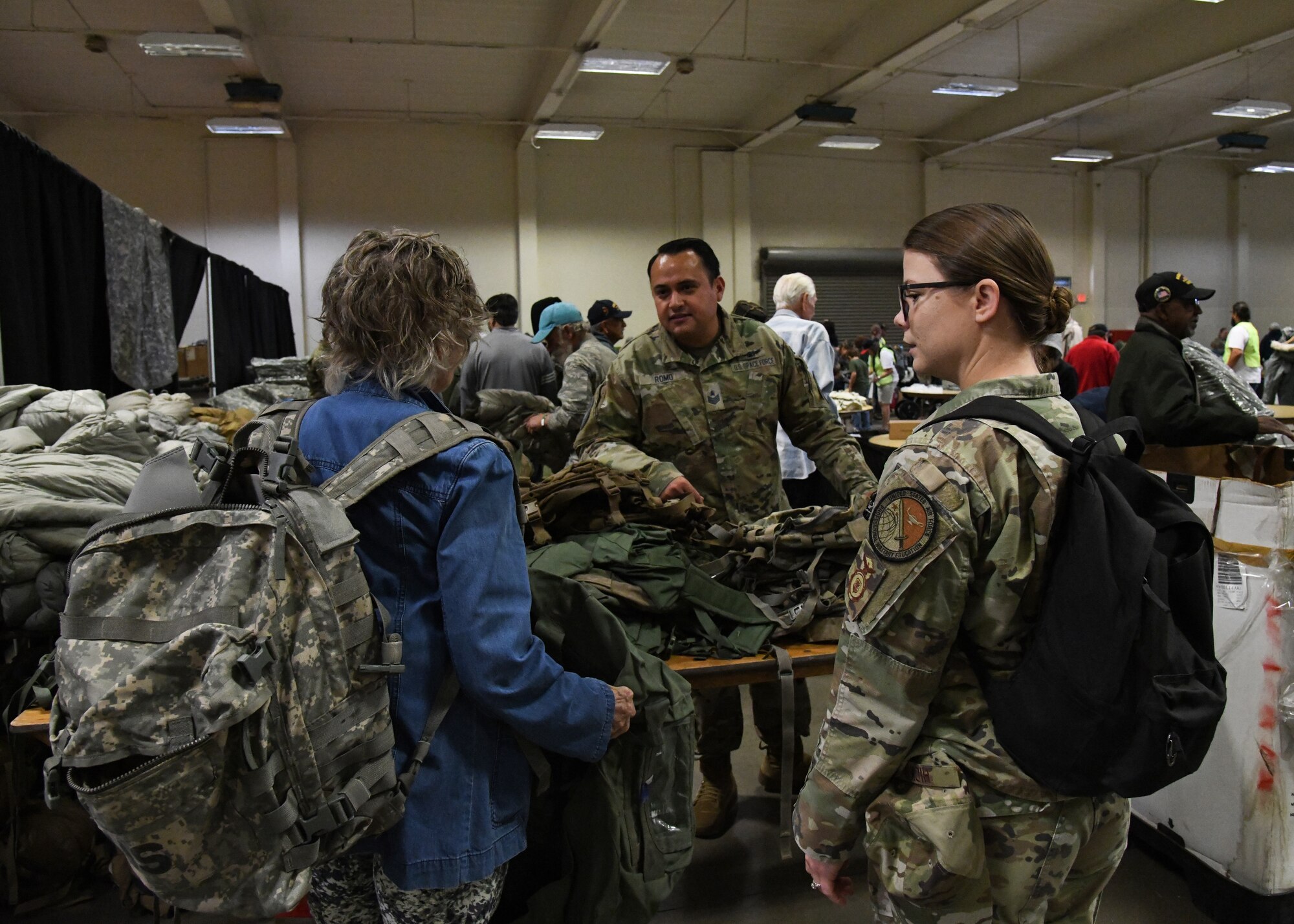 U.S. Space Force Tech. Sgt. Cesar Romo, 18th Space Defense Squadron crew chief, speaks to a local veteran at the 2023 Santa Barbara County Veterans Stand Down Day in Santa Maria, Calif., Oct. 28, 2023.