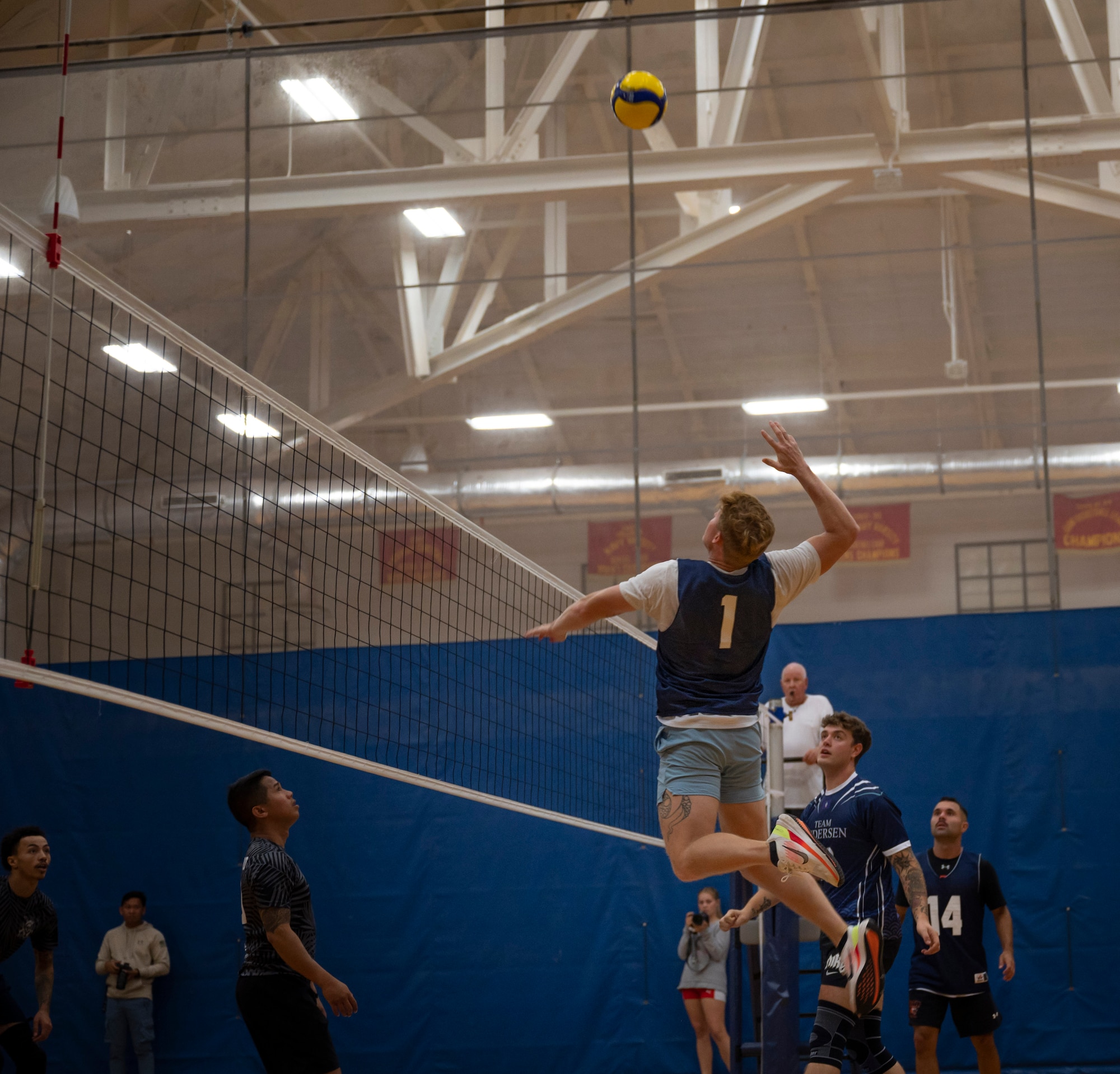 U.S. Air Force Staff Sgt. Joshua Bohling, a member of the Civil Engineer Squadron’s intramural volleyball team, jumps to spike the ball during the championship game on Andersen Air Force Base, Guam, Oct. 26, 2023. Andersen’s intramural volleyball league ended in a climactic final game between the Security Forces Squadron and CES. The game ended with SFS being named the champions. (U.S. Air Force photo by Airman 1st Class Spencer Perkins)