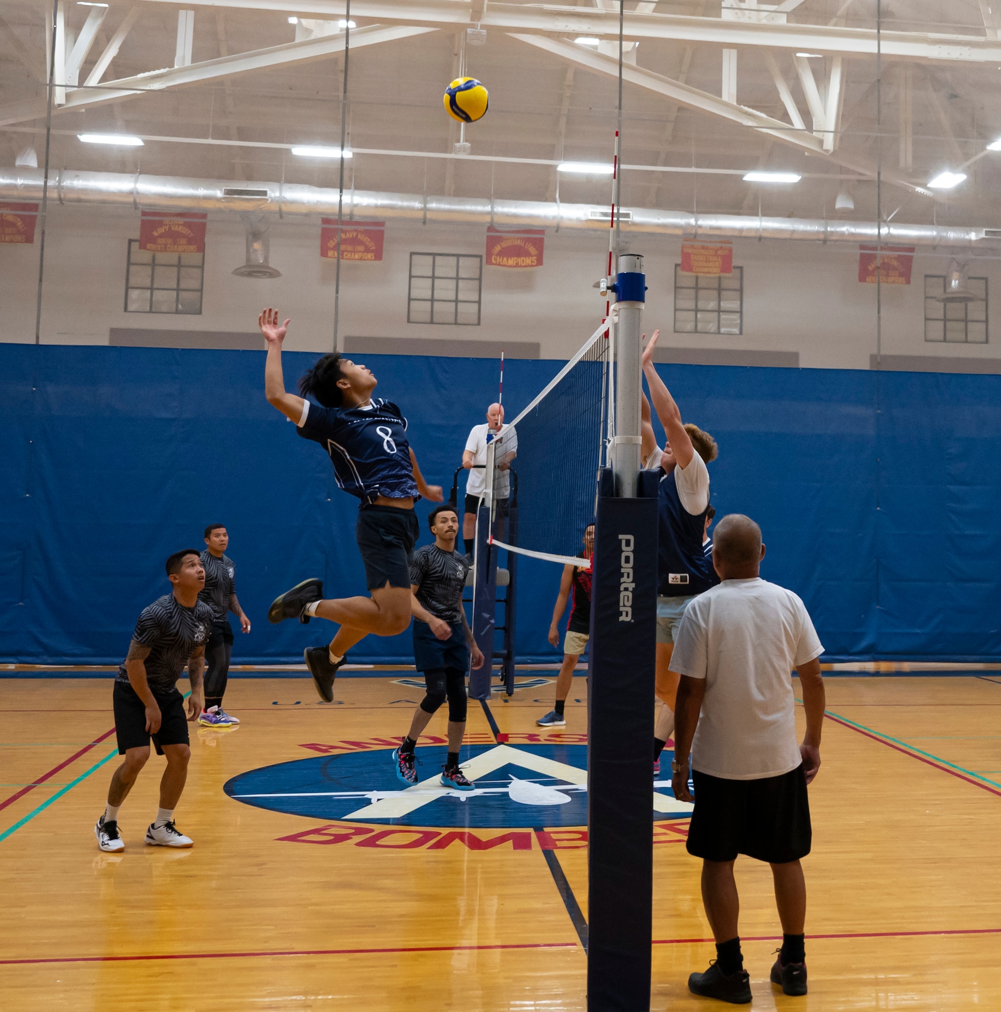 A member of the Security Forces Squadron’s intramural volleyball team jumps to spike the ball during the championship game on Andersen Air Force Base, Guam, Oct. 26, 2023.  Andersen’s intramural volleyball league ended in a climactic final game between the Security Forces Squadron and CES. The game ended with SFS being named the champions. (U.S. Air Force photo by Airman 1st Class Spencer Perkins)