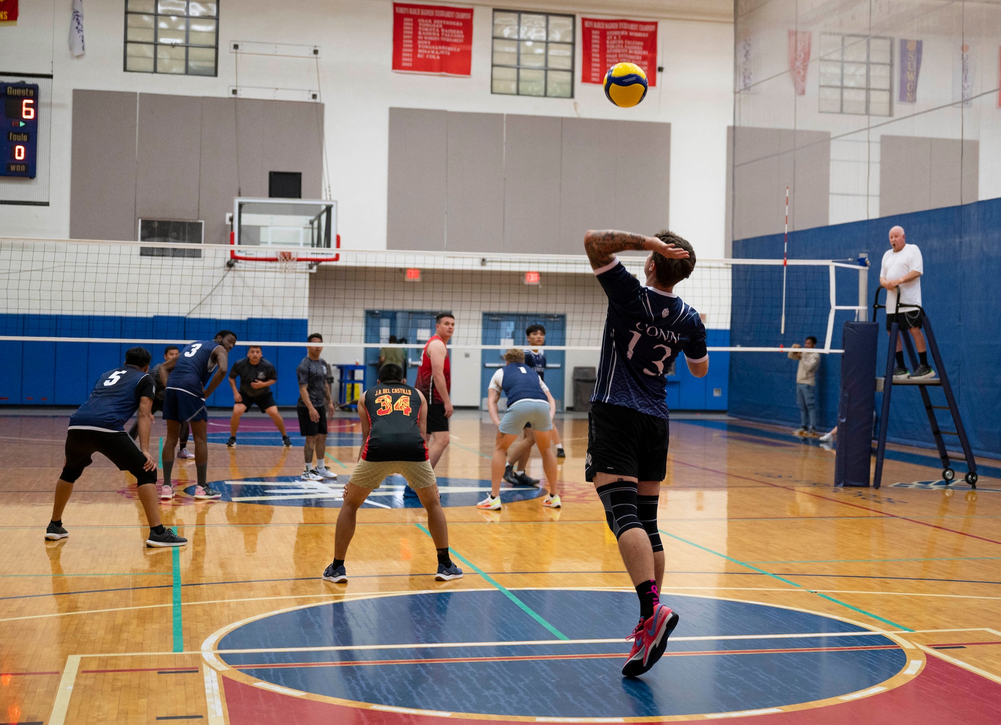 U.S. Air Force Senior Airman Archie Conn, a member of the Civil Engineer Squadron’s intramural volleyball team, serves the ball during the championship game on Andersen Air Force Base, Guam, Oct. 26, 2023.  Andersen’s intramural volleyball league ended in a climactic final game between the Security Forces Squadron and CES. The game ended with SFS being named the champions. (U.S. Air Force photo by Airman 1st Class Spencer Perkins)