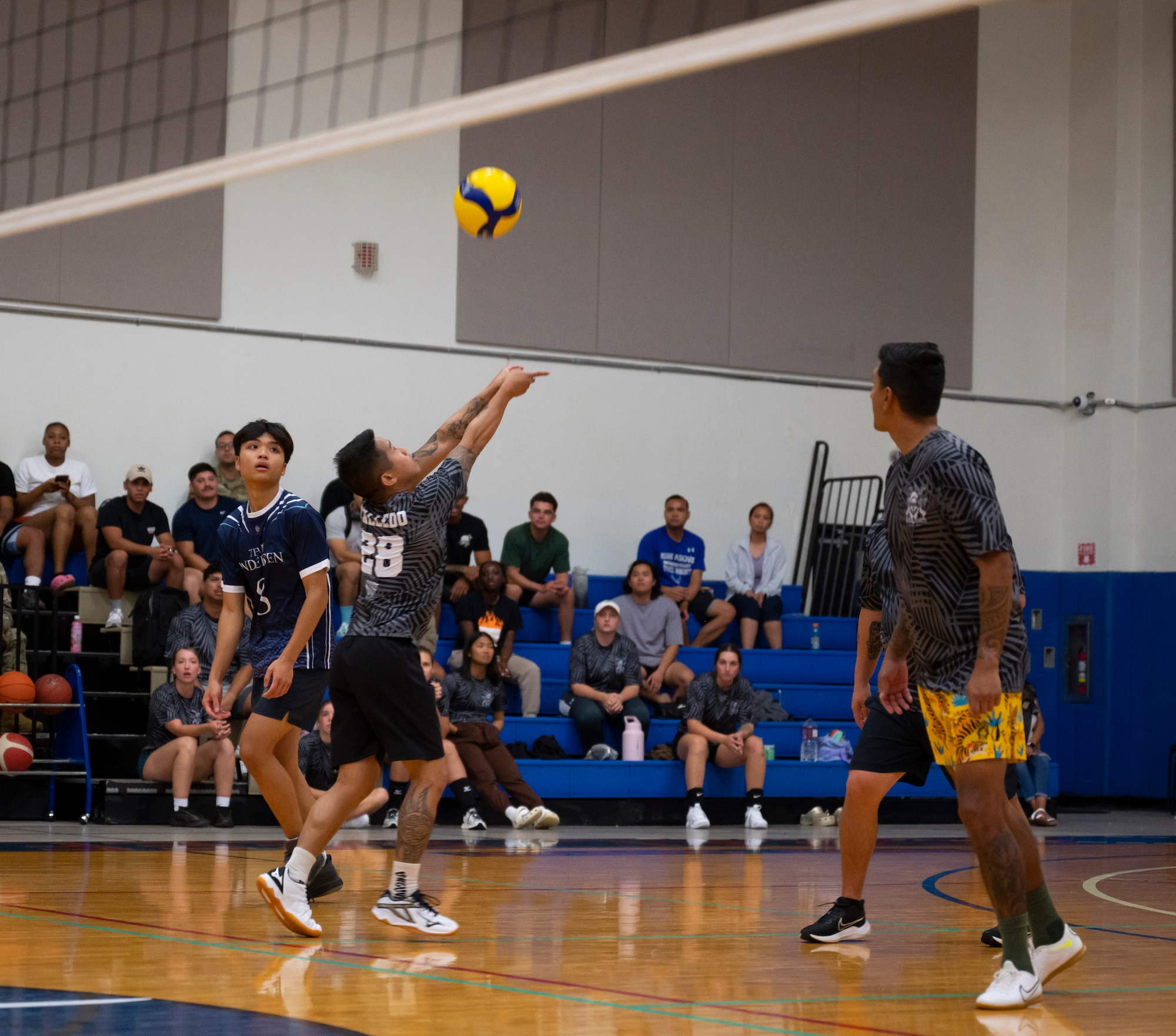 U.S. Air Force Staff Sgt. Sydney Talledo, a member of the Security Forces Squadron’s intramural volleyball team, sets the ball during the championship game on Andersen Air Force Base, Guam, Oct. 26, 2023.  Andersen’s intramural volleyball league ended in a climactic final game between the Security Forces Squadron and CES. The game ended with SFS being named the champions. (U.S. Air Force photo by Airman 1st Class Spencer Perkins)