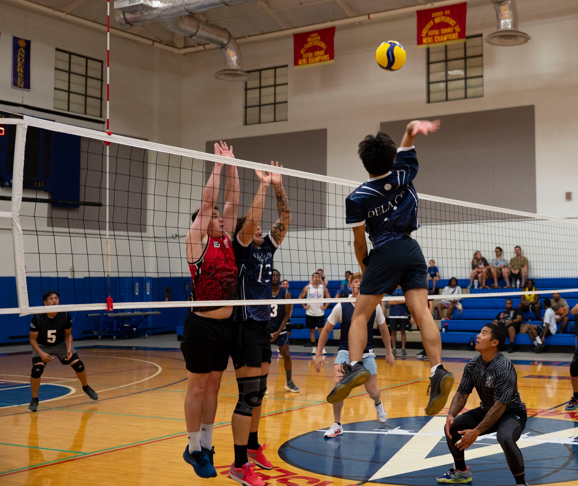 A member of the Security Forces Squadron’s intramural volleyball team jumps to spike the ball during the championship game on Andersen Air Force Base, Guam, Oct. 26, 2023.  Andersen’s intramural volleyball league ended in a climactic final game between the Security Forces Squadron and CES. The game ended with SFS being named the champions. (U.S. Air Force photo by Airman 1st Class Spencer Perkins)