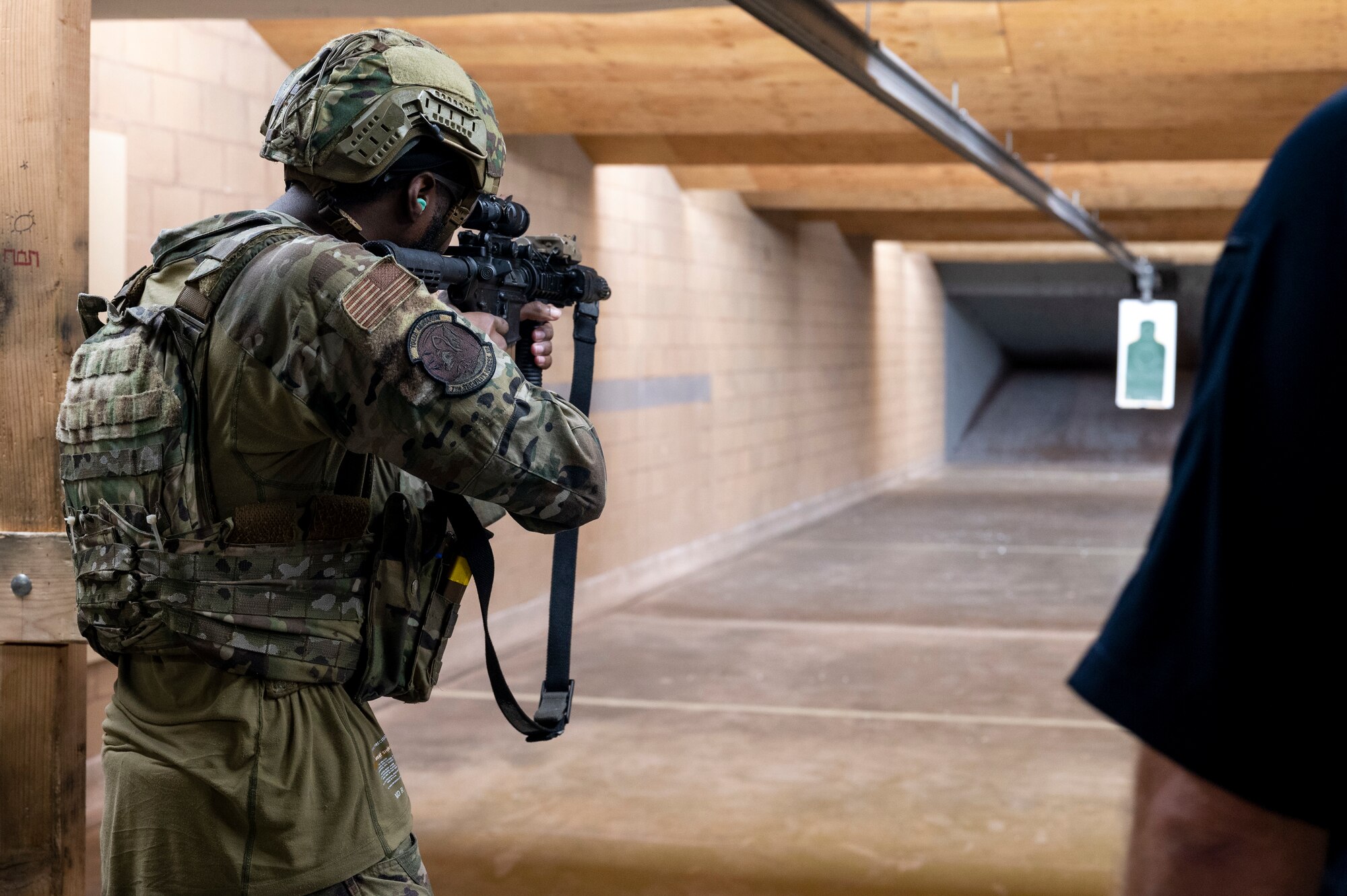 U.S. Air Force Senior Airman Jermaine Williams, 7th Security Forces Squadron defender, fires an M-4 rifle during the Expert Defender competition at Dyess Air Force Base, Texas, Oct. 25, 2023. Airmen from the 7th SFS ran from different points on the firing range, shot targets and prioritized safety for a rapid assessment of discipline and skill. (U.S. Air Force photo by Airman 1st Class Alondra Cristobal Hernandez)