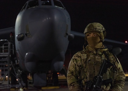 Senior Airman Cedric Amoranto, 5th Security Forces Squadron defender, provides perimeter security for a B-52H Stratofortress during Prairie Vigilance 24-1 at Minot Air Force Base, North Dakota, Oct. 23, 2023. Exercises like Prairie Vigilance continually develop Airmen and aircrew, improving capabilities and increasing mission readiness. (U.S. Air Force photo by Airman 1st Class Kyle Wilson)