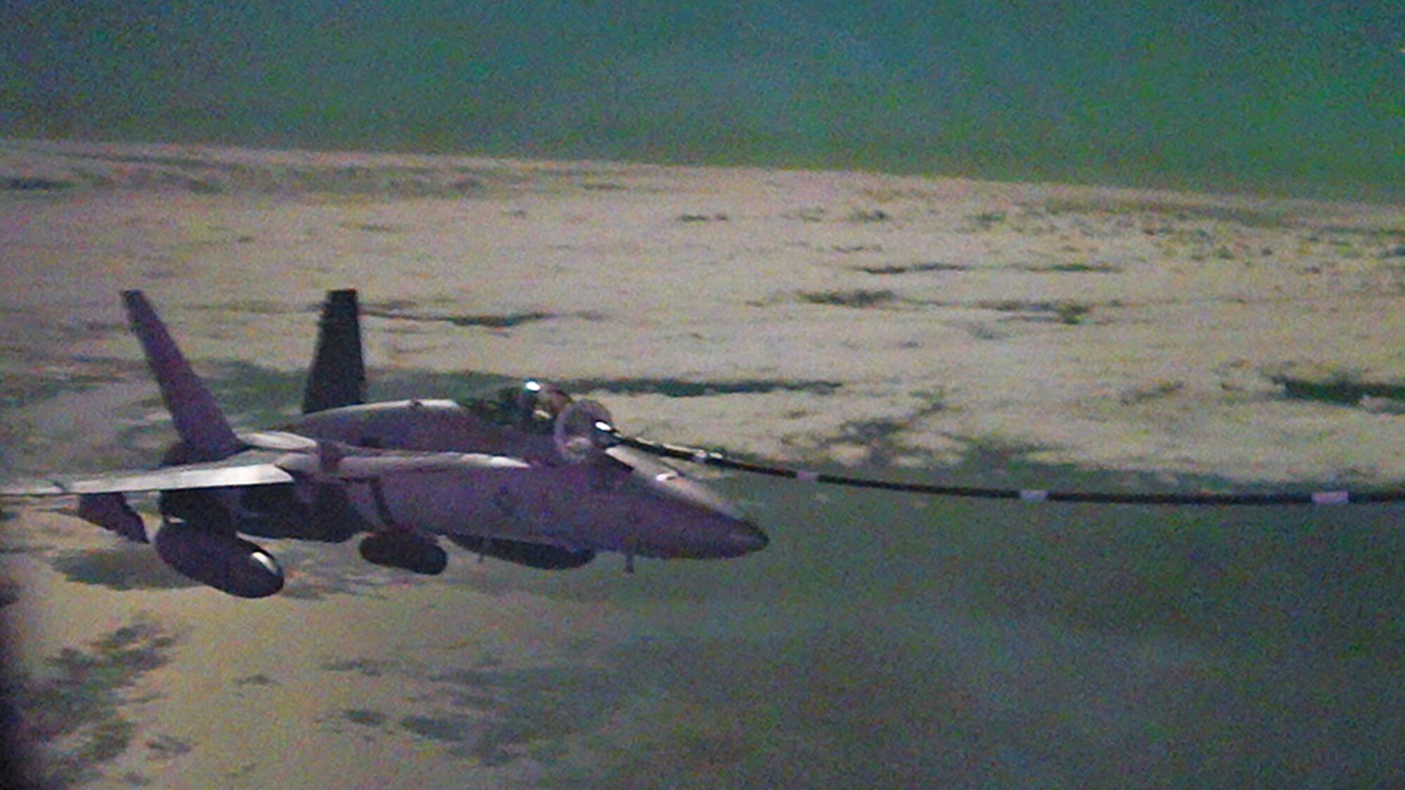 An F/A-18 Hornet fighter aircraft connects with an HC-130J Combat King II aircraft for high-speed air-to-air refueling Oct. 26, 2023 off the eastern South Carolina coast.