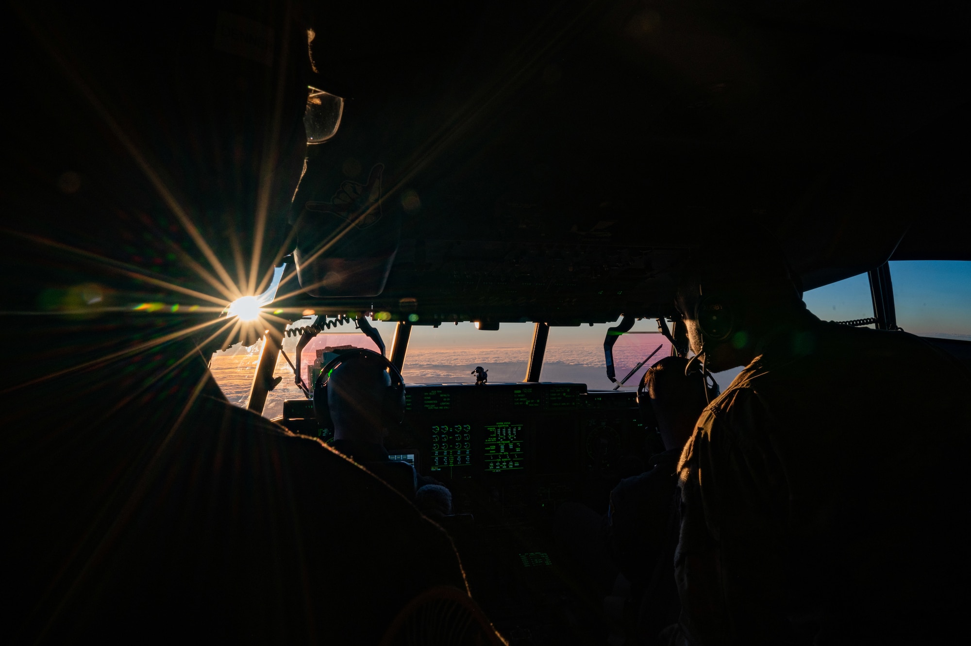 The sun begins to set as a 920th Rescue Wing HC-130J Combat King II aircrew fly off the eastern South Carolina coast, Oct. 26, 2023 to rendezvous with F-18 fighter aircraft for high-speed air-to-air refueling.